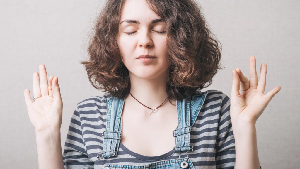 Female looking for peace through meditation